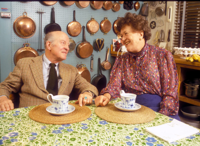 Photo of Julia and Paul Childs having tea and looking at one another in their kitchen