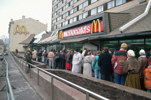 Customers lined up outside a McDonald's restaurant