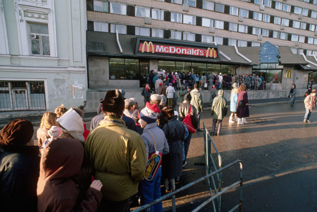 Customers lined up outside a McDonald's restaurant