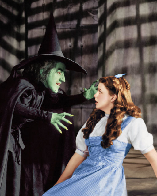 The wicked witch looms over Dorothy