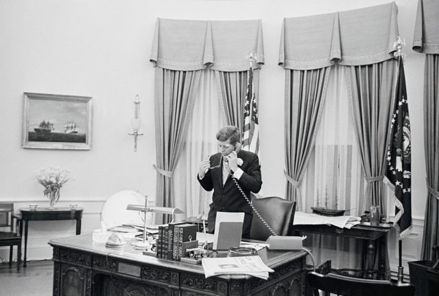 JFK talking on the phone in the Oval Office 