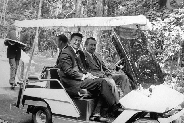 Ronald Reagan and Richard Nixon in a golf cart 