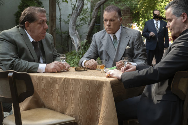 Ray Liotta sits at a table in character for The Many Saints of Newark.
