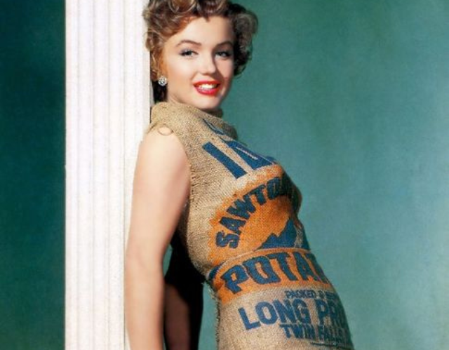 Marilyn Monroe poses wearing a dress made from a potato sack. 