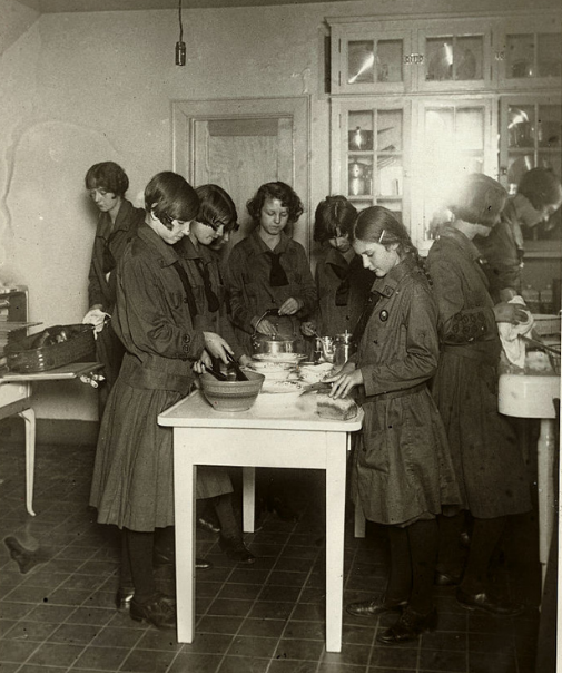 Girl Scouts preparing a meal