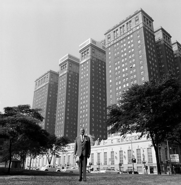 Conrad Hilton in front of one of his Hilton Hotels