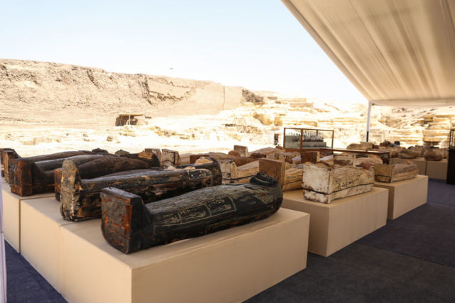 Lines of newly-discovered Egyptian coffins on display