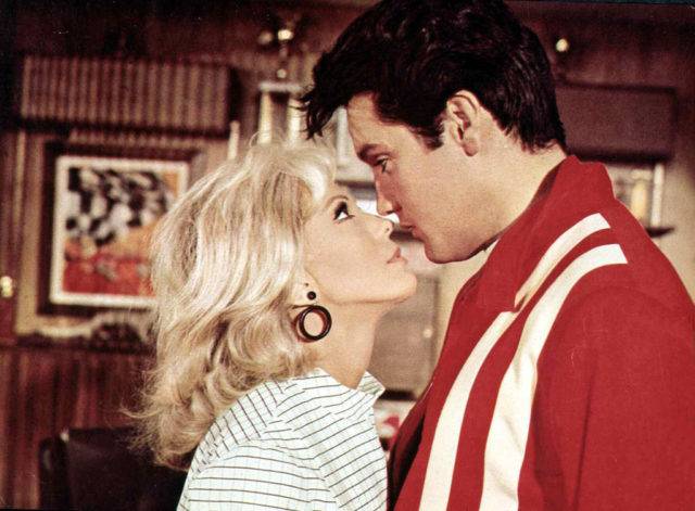 Nancy Sinatra and Elvis Presley nearly kiss while filming Speedway