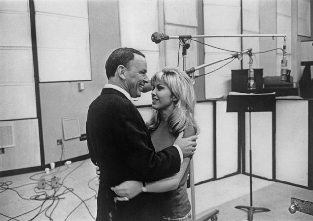 Frank and Nancy hugging in the studio