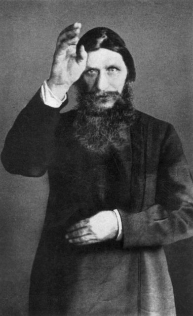 Photo of Rasputin with his hand raised