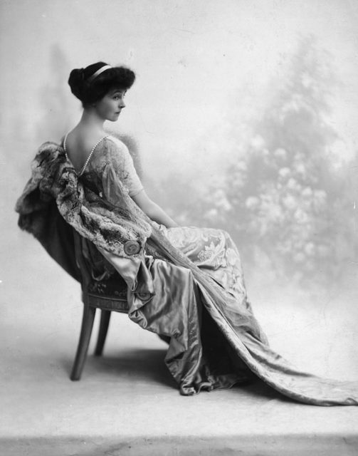 Duchess Consualo of Marlborough poses in a chair
