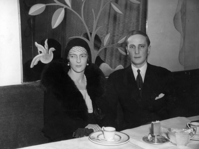Irina and Felix Yusupov sit as a table in fancy dress