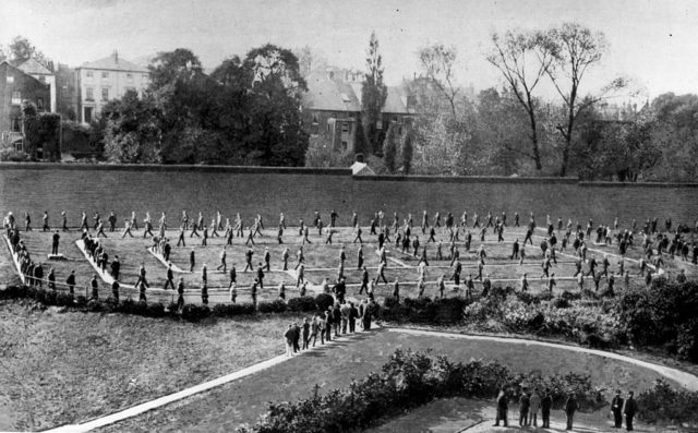Prisoners walk in a circle outside Holloway Prison