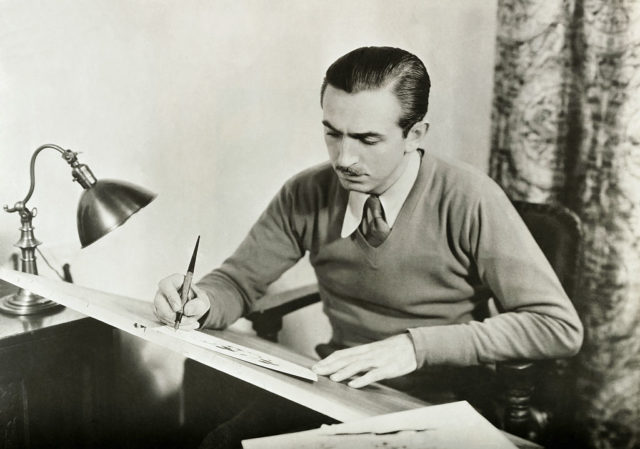 Walt Disney drawing his designs.