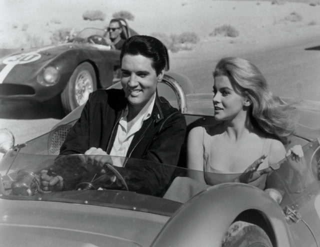 Elvis and female costar in a race car