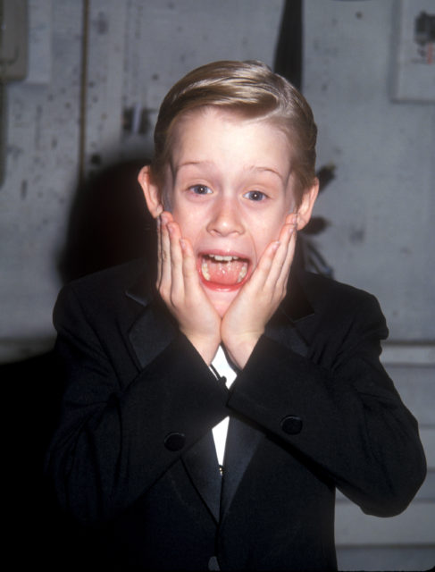 Macaulay Culkin holding his face and screaming