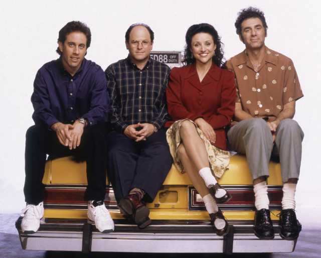 Promo shot for Seinfeld, Jerry, George, Elaine, and Kramer sit on the trunk of a taxi