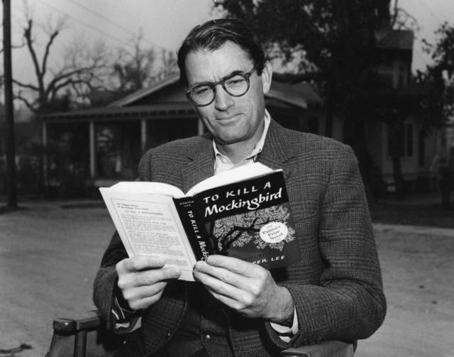 Gregory Peck reads a novel