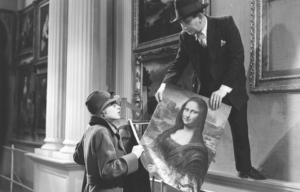 Black and white photo from a movie of a man and woman replacing the Mona Lisa with a fake.