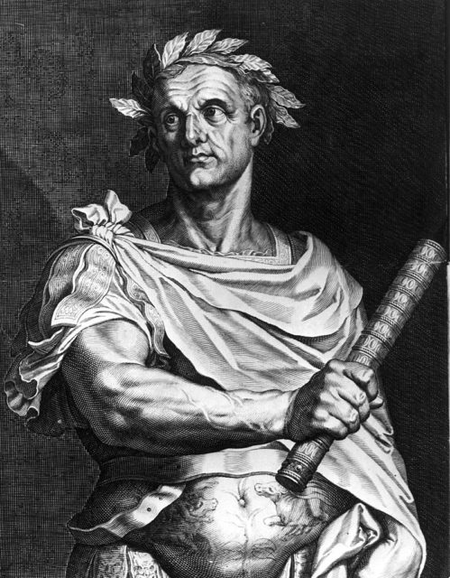 Black and white drawing of Julius Caesar holding a baton wearing a laurel wreath and a cloak.