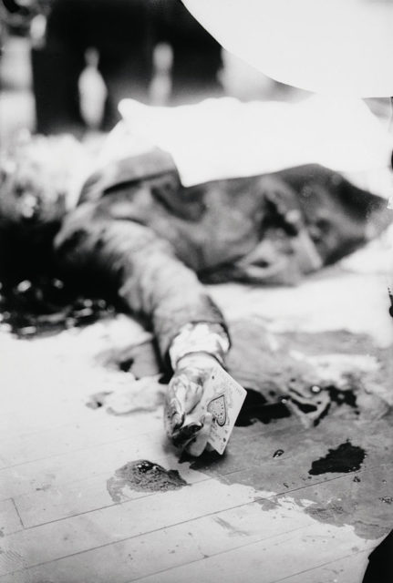 The body of Joe Masseria shows an ace of spades in his hand after he was assassinated