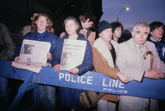 Fans crowd outside Lennon's apartment after his death