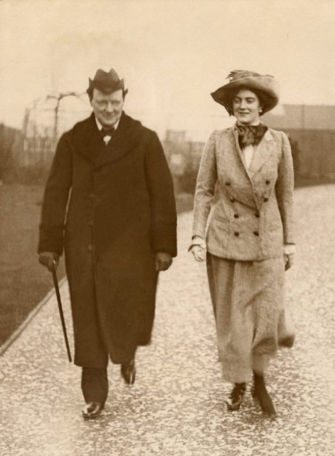 Clementine Churchill walking beside Winston Churchill
