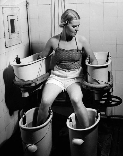 Woman taking an "electric bath"