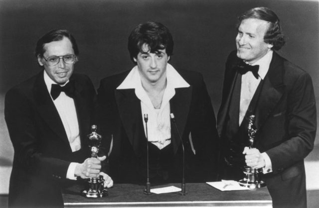Sylvester Stallone and Irwin Winkler receiving Oscar awards for Rocky