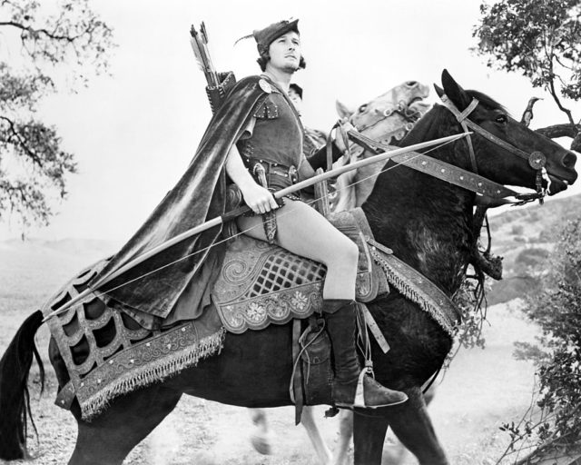 Errol Flynn on horseback in costume as Robin Hood for the 1938 film