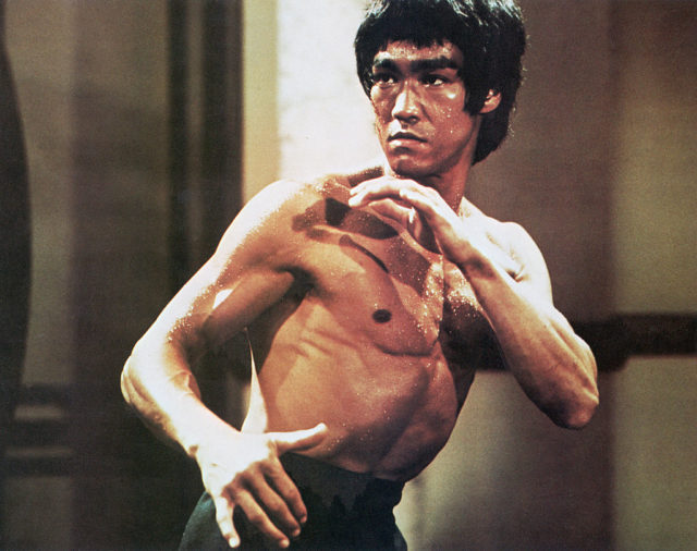 Bruce Lee posing for a movie scene