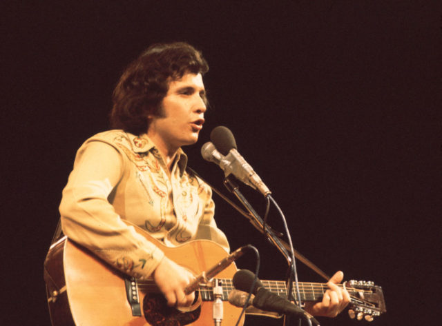 Don McLean on stage with guitar