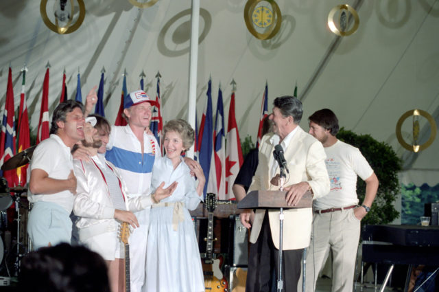 President Ronald Reagan and First Lady Nancy Reagan standing with The Beach Boys