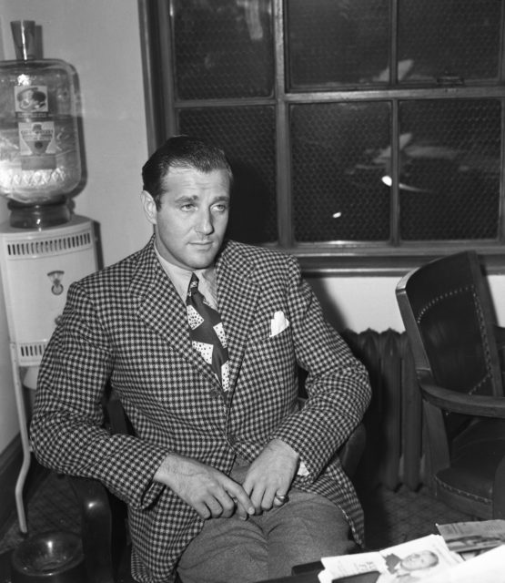 Bugsy Siegel sitting in a chair