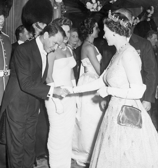 Frank Sinatra shaking hands with Queen Elizabeth II
