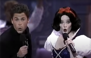 Rob Lowe and Eileen Bowman as Snow White sing on stage