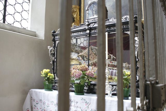 Saint Munitia's ossuary behind an iron gate at St Peter's Church, Munich