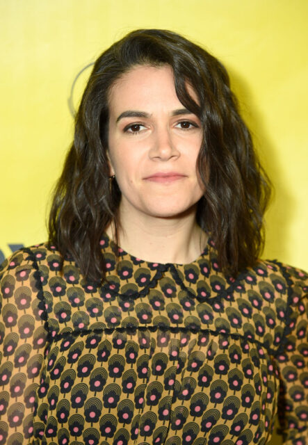 Abbi Jacobson standing on a red carpet