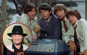 Group photo of The Monkees + Micky Dolenz smiling