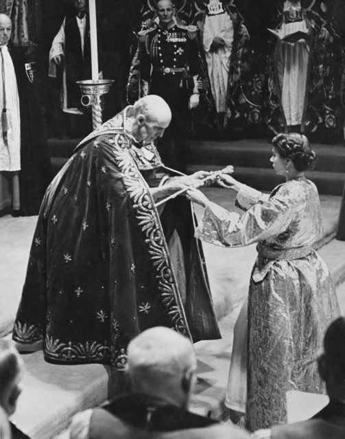 Queen Elizabeth II accepting the royal scepter at her coronation. 