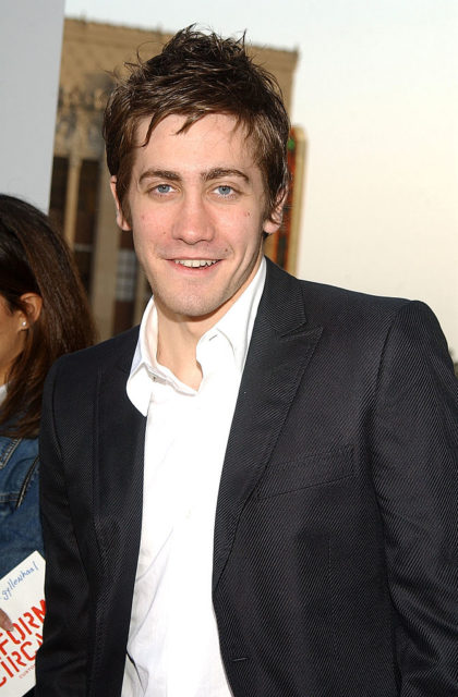 Jake Gyllenhaal wearing a collared shirt and suit jacket