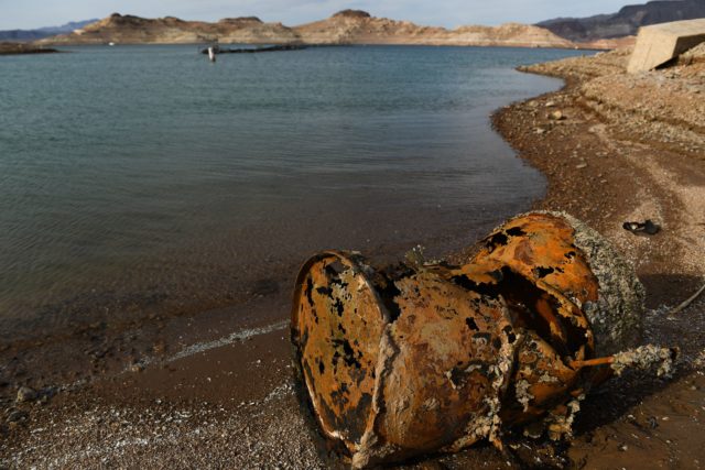 A rusted barrel on the shore of Lake Mead