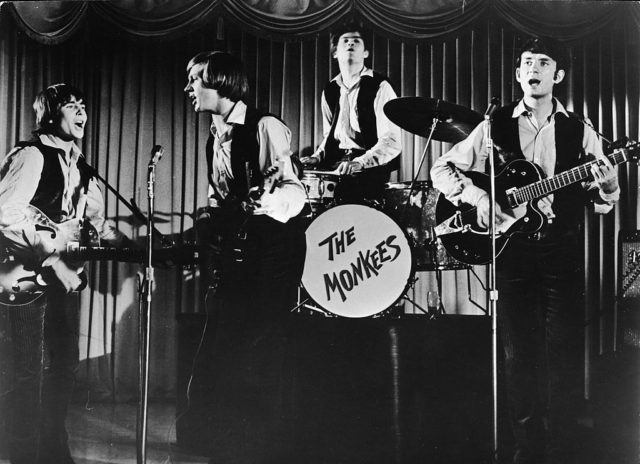 The Monkees performing on stage