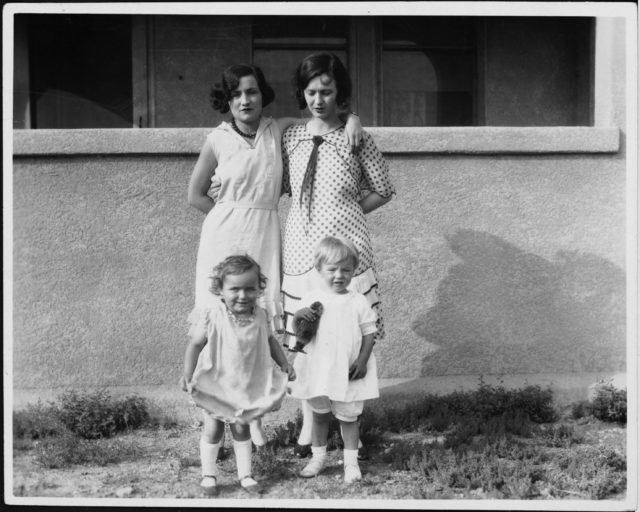 Gladys and Norma Jeane Baker standing with another woman and her child