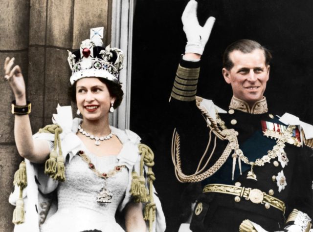 Queen Elizabeth II and Prince Philip wave from the balcony of Buckingham Palace on the day of their coronation