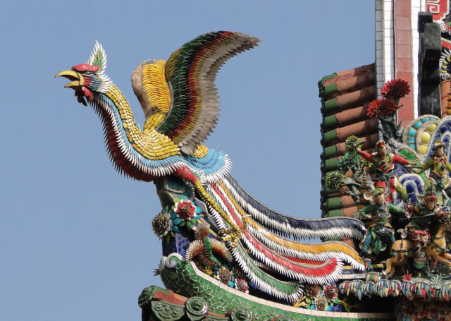A Fenghuang depicted on the roof of a Chinese temple