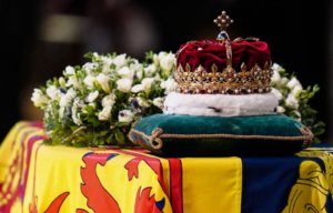 Crown of Scotland and a wreath of flowers sitting atop Queen Elizabeth II's coffin