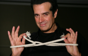 David Copperfield with his wrists tied