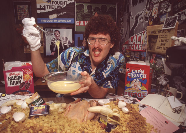 Weird Al Yankovic poses with cereal all around him