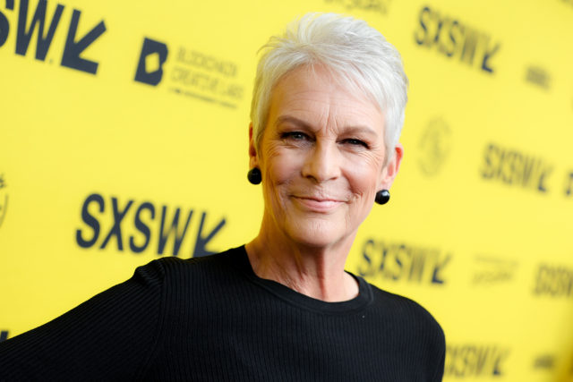 Headshot of Jamie Lee Curtis with a yellow background